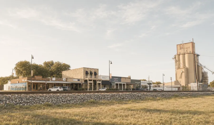 A small-town main street and grain elevator in Parker County, Texas, where Brent and Slaten Gough's team does community work